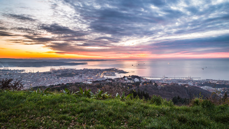 the sun goes down in the bay of Trieste, Italyの写真素材