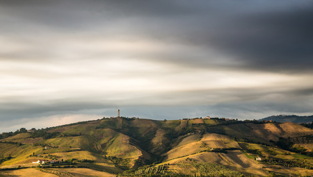 a view of the countryside in a cloudy spring evening