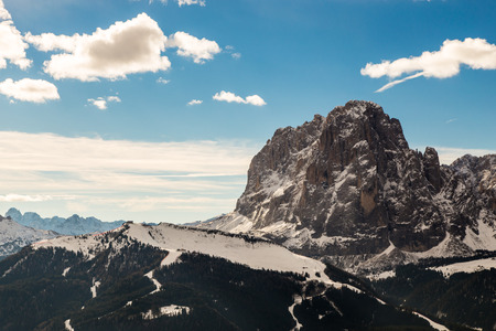winter in the italian alps, with the ski slope full of snowの写真素材