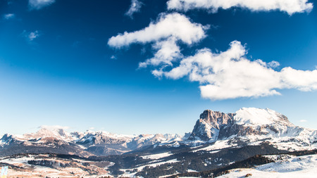 winter in the italian alps, with the ski slope full of snow