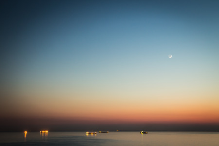 young moon over the sea of Triesteの写真素材