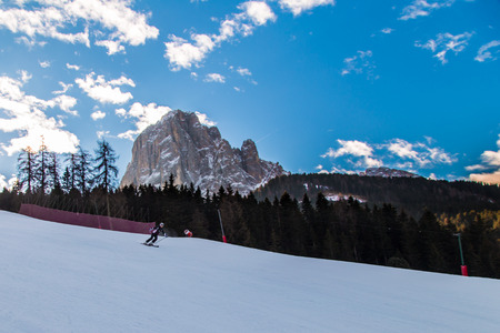 winter in the italian alps, with the ski slope full of snowの写真素材