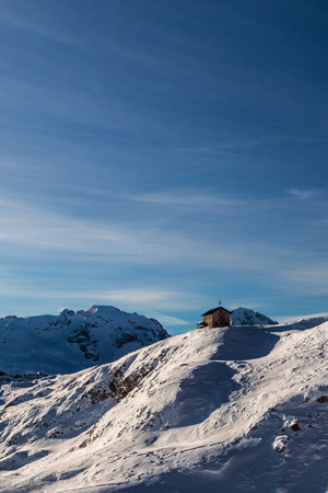 winter in the italian alps, with the ski slope full of snowの写真素材