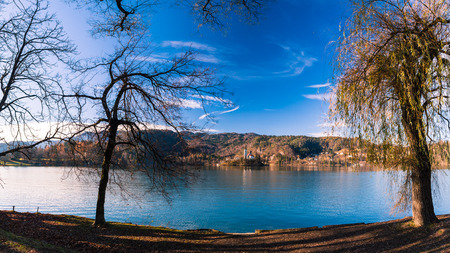 Reflections on the lake of Bled in a cold autumn morningの写真素材