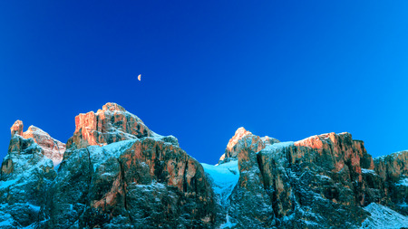 a windy winter evening in the italian alpsの写真素材