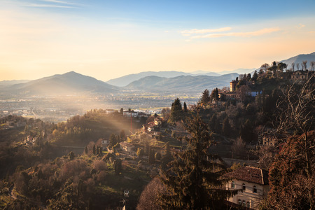 The sun goes down on the city of Bergamo, Italyの写真素材