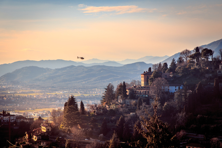 The sun goes down on the city of Bergamo, Italyの写真素材