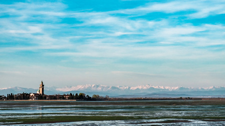 The ancient Sanctuary of Barbana with snowy mountains in the backgroundの写真素材