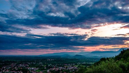 Sunset in a stormy evening in the fields of Friuli Venezia-Giulia, Italy