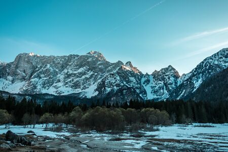 Sunset in front of the mount Mangart in the Italian Alpsの写真素材