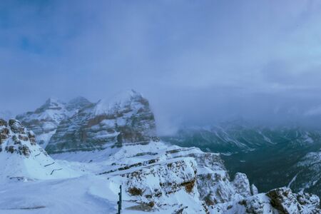 Clouds carrying snow in the italian alpsの写真素材