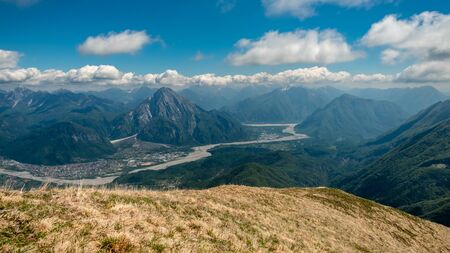 Reaching the top of a mountain in the Carnic Alps, Friuli-Venezia Giulia, Italyの写真素材
