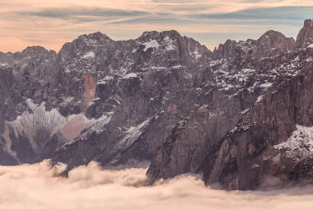Clouds in the valley under the peak of Julian Alpsの写真素材