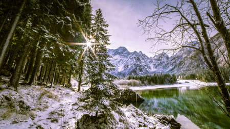 First snow of the winter at a lake in the italian alpsの写真素材