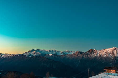 Sunset in the mountains between Slovenia and Italy in a freezing winter day