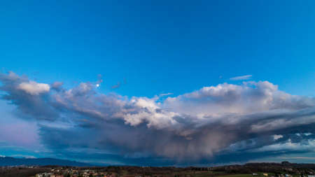 The sun goes behind the clouds over the countryside of Udine, Friuli-Venezia Giulia, Italyの写真素材