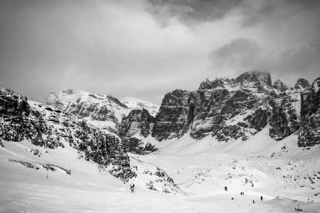 Clouds carrying snow in the italian alpsの写真素材