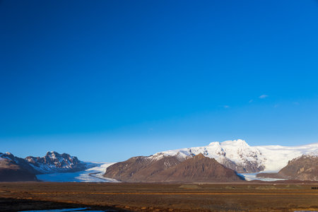 The sun always gives a beautiful atmosphere in late winter in icelandの写真素材