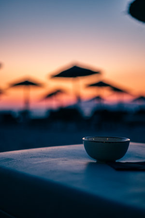 Evening at a beach bar with drinksの写真素材