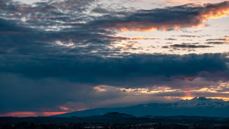The sun goes behind the clouds over the countryside of Udine, Friuli-Venezia Giulia, Italyの写真素材