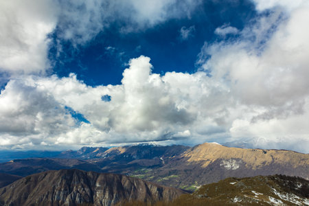 Clouds in the sky over mount matajur, friuli venezia-giulia, italyの写真素材
