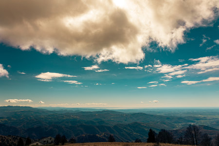 Clouds in the sky over mount matajur, friuli venezia-giulia, italyの写真素材