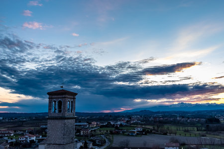 The sun goes behind the clouds over the countryside of Udine, Friuli-Venezia Giulia, Italyの写真素材
