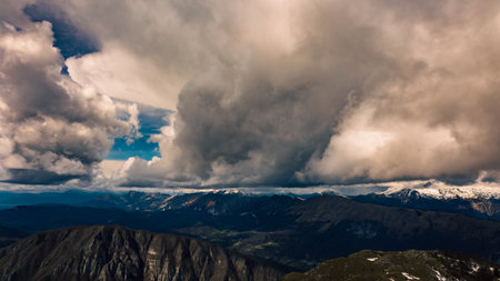 Clouds in the sky over mount matajur, friuli venezia-giulia, italyの写真素材
