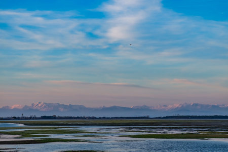 Sun goes down on the lagoon of Grado in a spring dayの写真素材