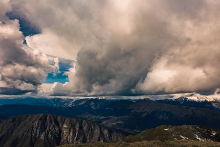 Clouds in the sky over mount matajur, friuli venezia-giulia, italyの写真素材