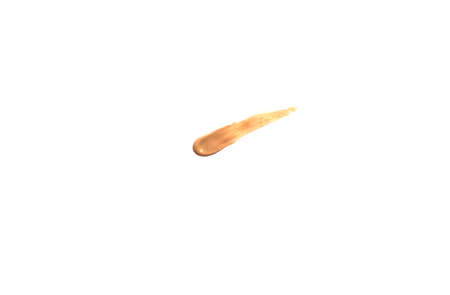 A smear of natural beige foundation isolated on a white backgroundの写真素材