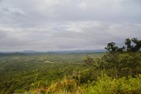 View the beautiful landscape of rocky cliffs and green hills in Cubaの写真素材