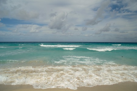 beautiful scene from the coast of Cuba, Varadero - dark-blue horizon of the azure waters of the Atlantic ocean, the blue sky and white clouds, and white sandy beachesの写真素材