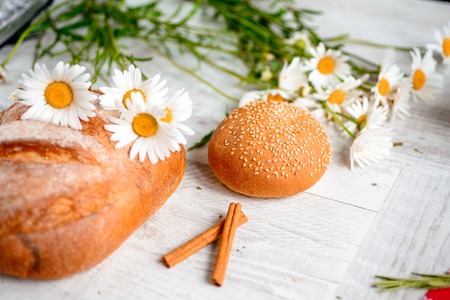 Fresh bread on the table. Background food.の写真素材