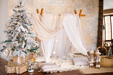 Christmas decorated bedroom interior. Cozy home moment. Concept Happy New Yearの写真素材