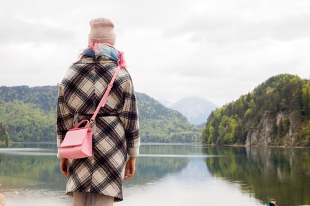girl near the lake Neuschwanstein castleの写真素材