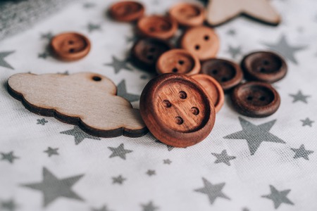 wooden buttons handmade in beautiful cotton fabrics in grey stars , reels of thread. next wooden toy...