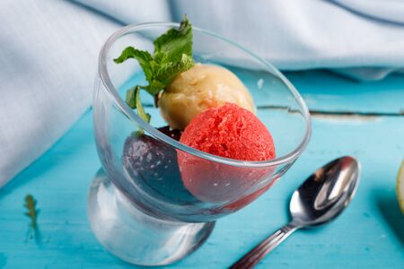 Assorted ice cream, sorbet, ice cream. Summer healthy refreshing dessert. Vegetarian (vegan) fashionable food concept. Background of wooden boards, close-upの写真素材