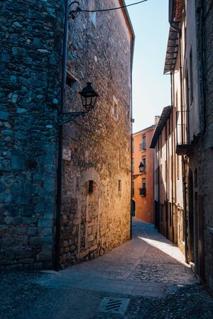 Medieval streets of Girona. Medieval alley with stone walls in Girona.の写真素材