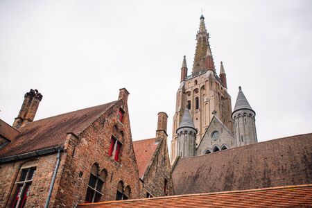 Bruges, Belgium. Morning view of Church of Our Lady Vrouwekerk from Bonifacius Bridge in Brugge, West Flanders.の写真素材