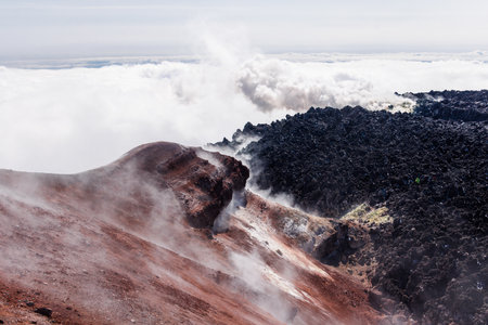 Beautiful Kamchatka volcanic landscape: Avachinsky Volcano - active volcano of Kamchatka Peninsula. View of the fumarolic activity of volcano, steam and gas emissions from crater. Russia, Far East.の写真素材