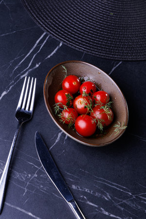 Fresh Red Tomatoes in a Rustic Bowl Garnished with Dillの写真素材