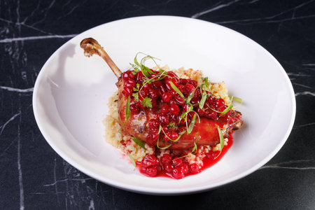 Gourmet Lamb Shank With Cranberry Sauce On Creamy Risotto Plateの写真素材