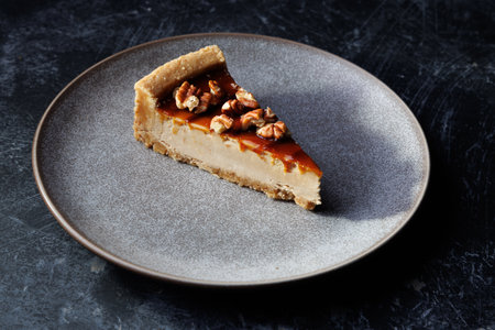 Caramel Pecan Pie Slice On Plate, Rich Dessert With Nuts And Creamy Fillingの写真素材
