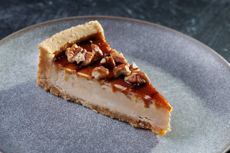 Caramel Pecan Pie Slice On Plate, Rich Dessert With Nuts And Creamy Fillingの写真素材