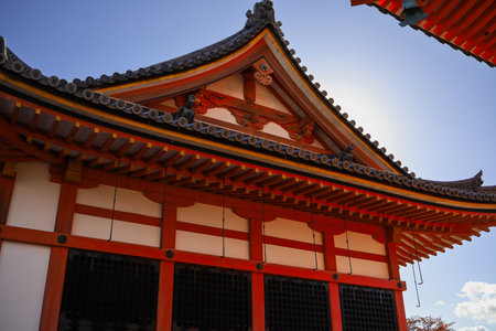 A traditional Japanese temple complex in Kyoto featuring a striking five-story pagoda and red wooden roofs. Bright daytime setting, rich in culture and historic architecture.の写真素材