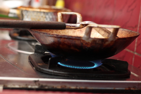 frying tofu in a frying panの写真素材