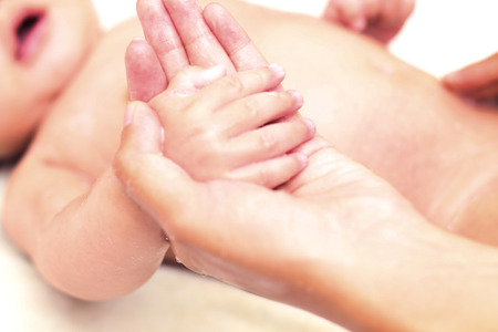 holding the baby's handの写真素材