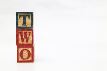 The arrangement of letters forms one word, "TWO"の写真素材