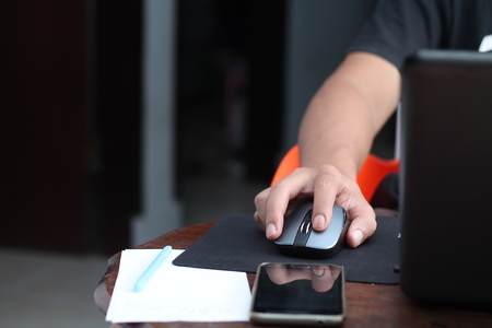 holding the laptop mouseの写真素材